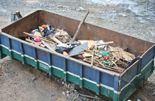 Professionals clearing a cluttered garage in Tower Hamlets